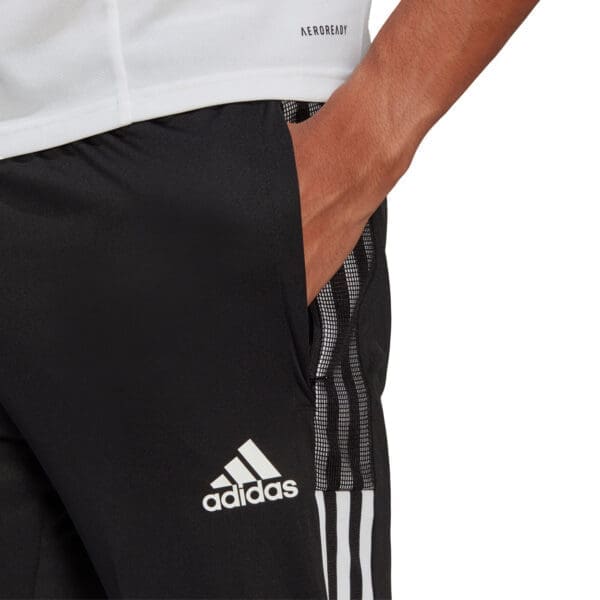 Black Adidas pants with white stripes and logo.