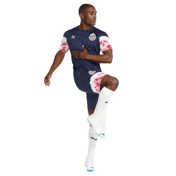 Man wearing a blue and white soccer uniform.