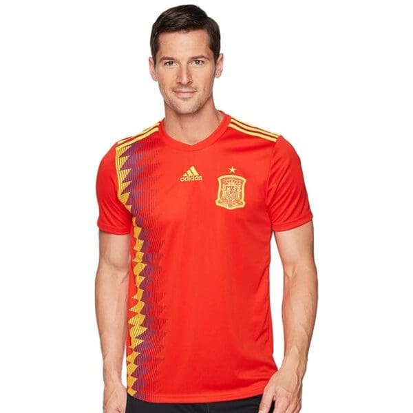 Man wearing Spain soccer jersey by Adidas.