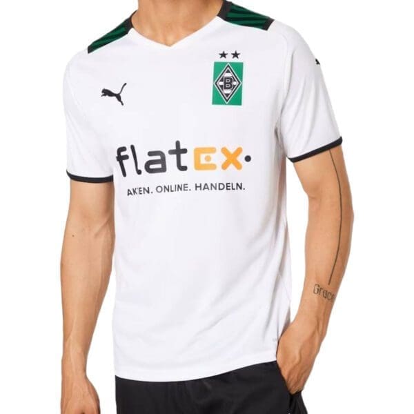 Man wearing a white Borussia Mnchengladbach jersey.