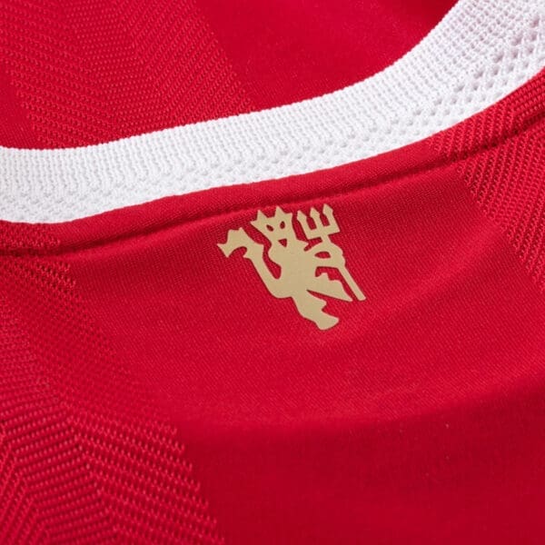 Liverpool FC jersey with gold crest.