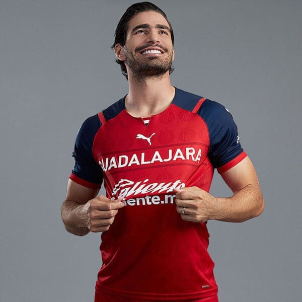 Man in red and blue Guadalajara jersey.