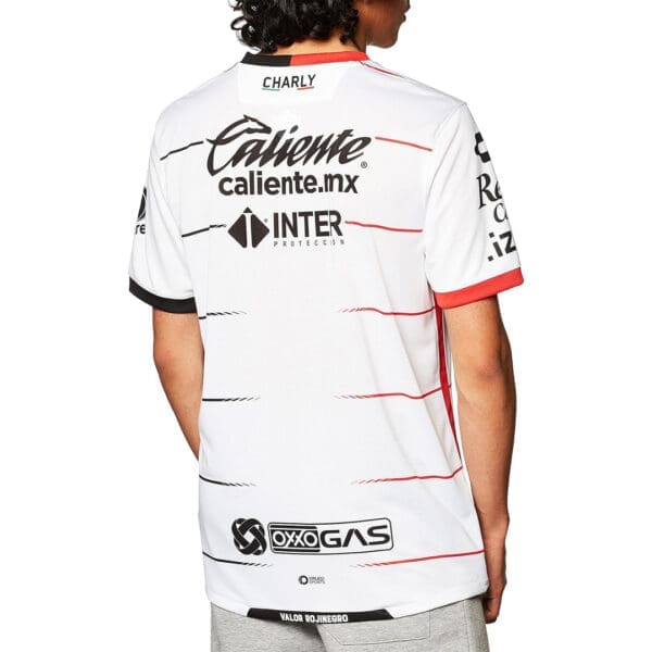 White and red soccer jersey back view.