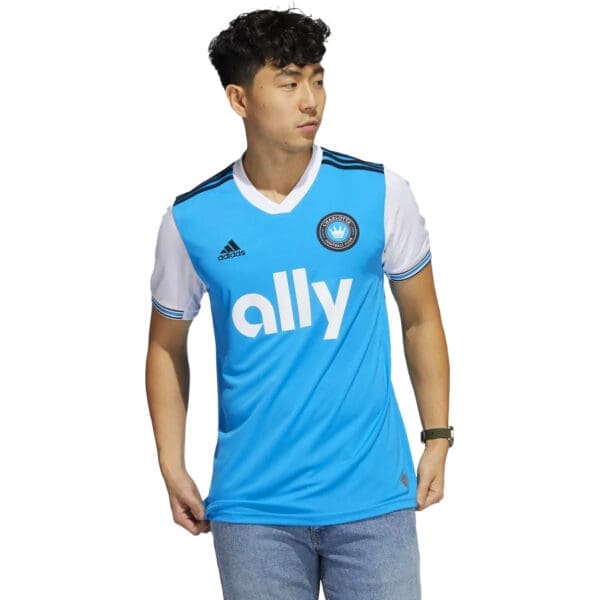 Man wearing a blue Ally FC jersey