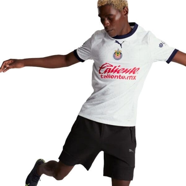 Man wearing a white soccer jersey.