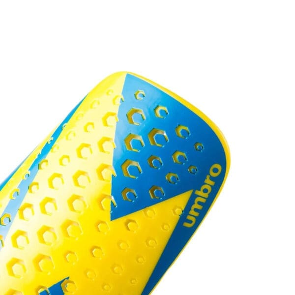 Yellow and blue Umbro shin guard.