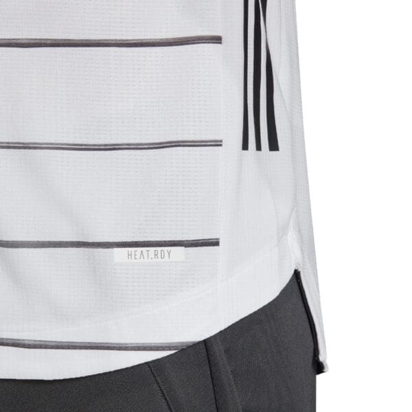 White striped athletic shirt with adidas logo.