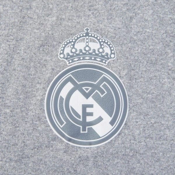 Real Madrid soccer team logo on grey fabric.