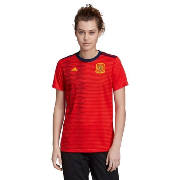 Woman wearing a red Spain soccer jersey.