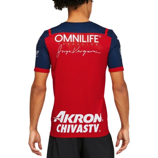 Red and navy soccer jersey back view.