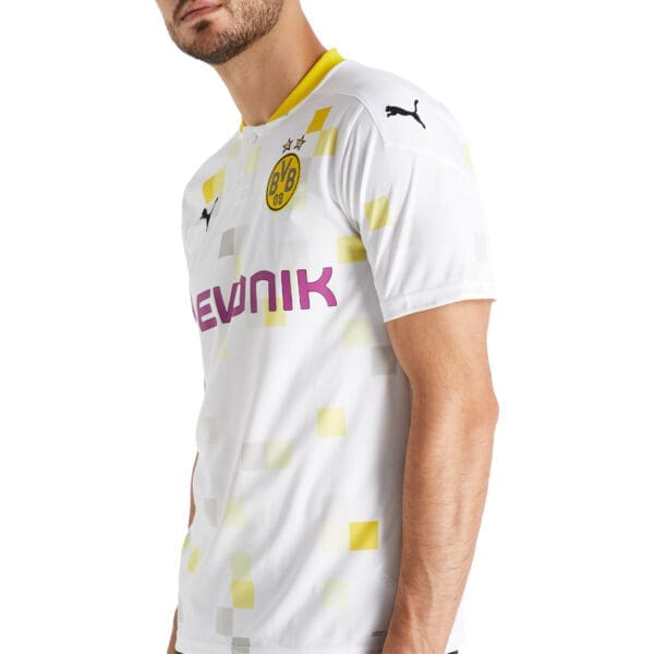 Man wearing white Borussia Dortmund jersey.