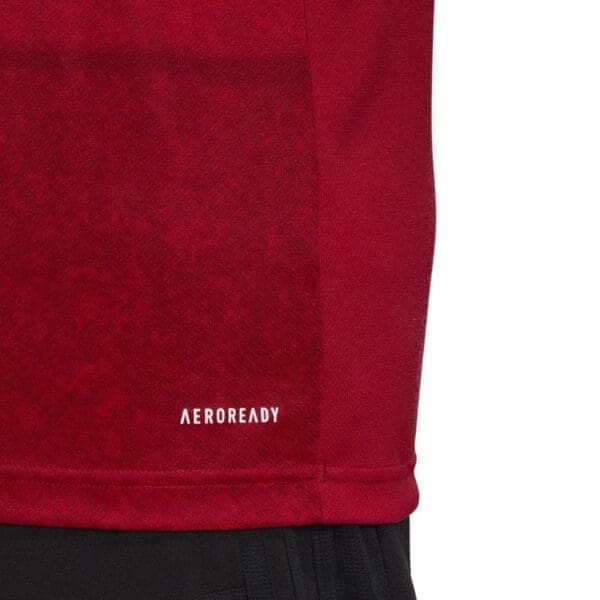 Red Adidas Aeroready shirt detail.