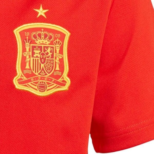 Red soccer jersey with Spanish crest.