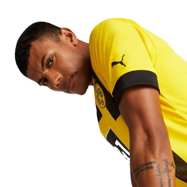 Man wearing a yellow Borussia Dortmund jersey.