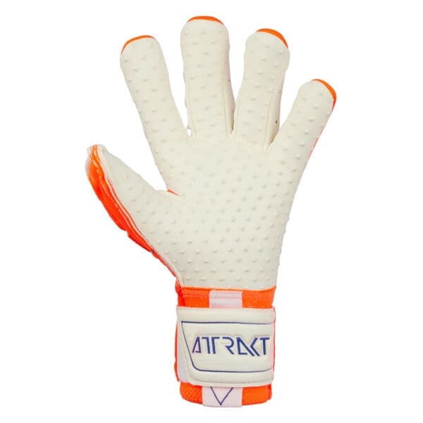 White and orange goalkeeper glove with attract logo.