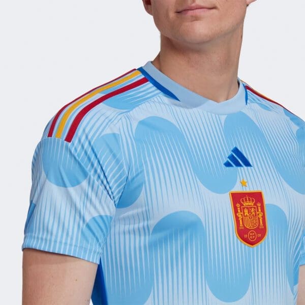 Spain soccer jersey with crest and stripes.