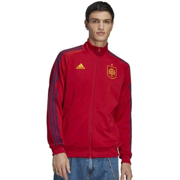 Man wearing a red Spain Adidas jacket.