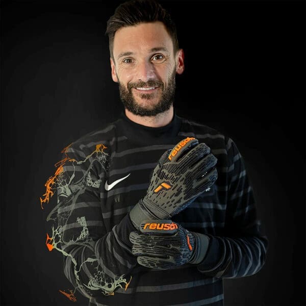 Man wearing Reusch goalkeeper gloves.