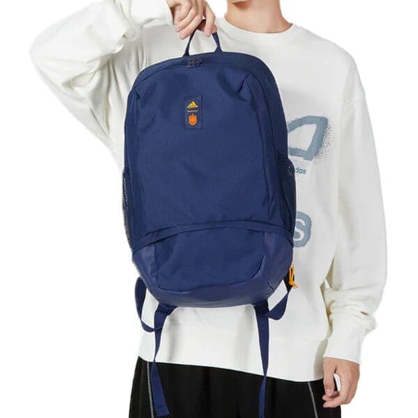 Blue Adidas backpack with orange logo.