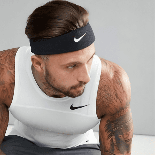 Man wearing a black Nike headband.