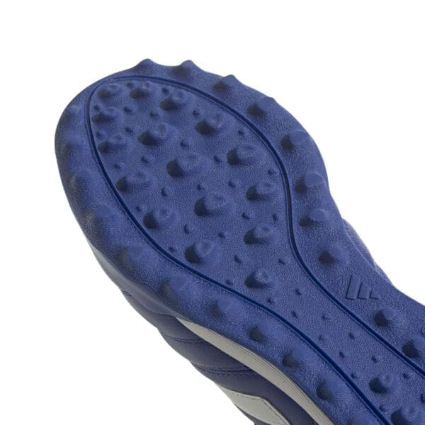 Blue soccer shoe with rubber outsole.