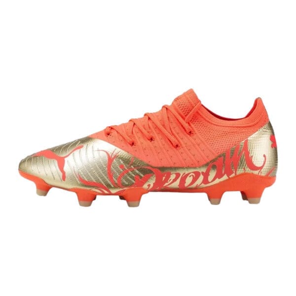 Orange and gold Puma soccer cleats.