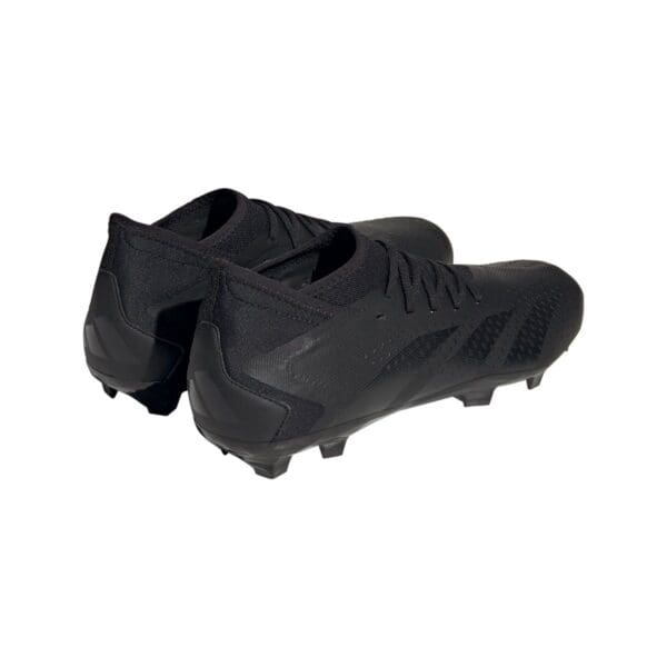 Pair of black Adidas soccer cleats.