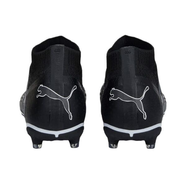 Black Puma soccer cleats, back view.