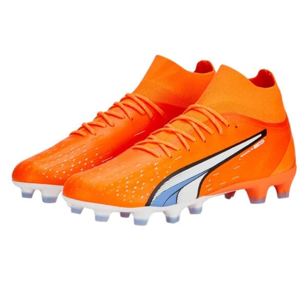 Orange and white Puma football boots.