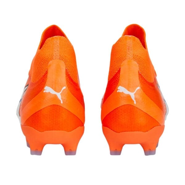 Orange Puma soccer cleats with white logo.