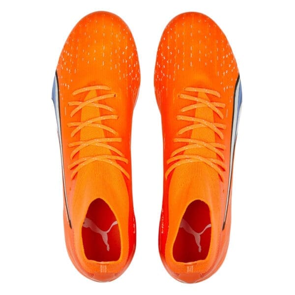 Orange and blue Puma soccer cleats.