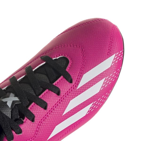 Pink Adidas soccer cleat with black laces.