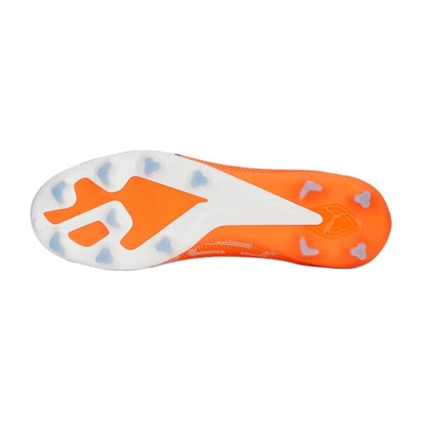 Orange and white soccer cleat sole.