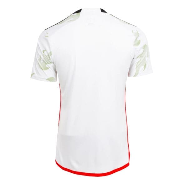 White soccer jersey with green pattern.