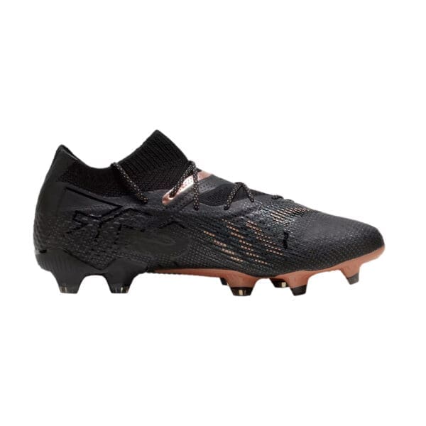 Black and gold soccer cleats with studs.