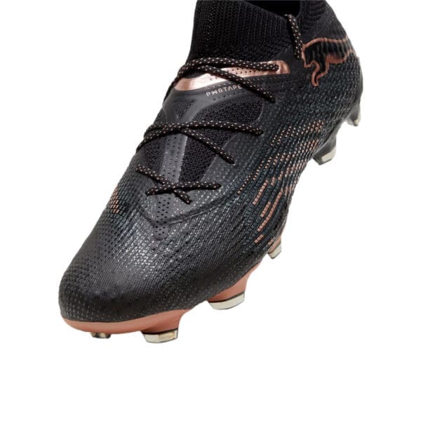 Black and rose gold Puma football boot.