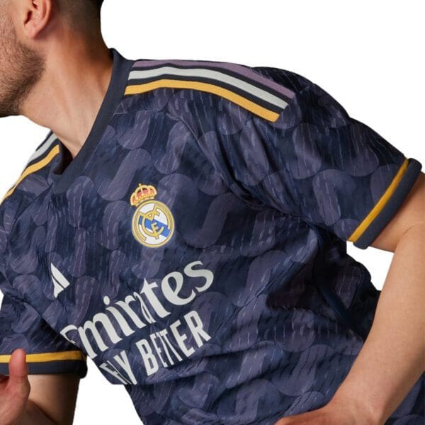 Man wearing a Real Madrid jersey.