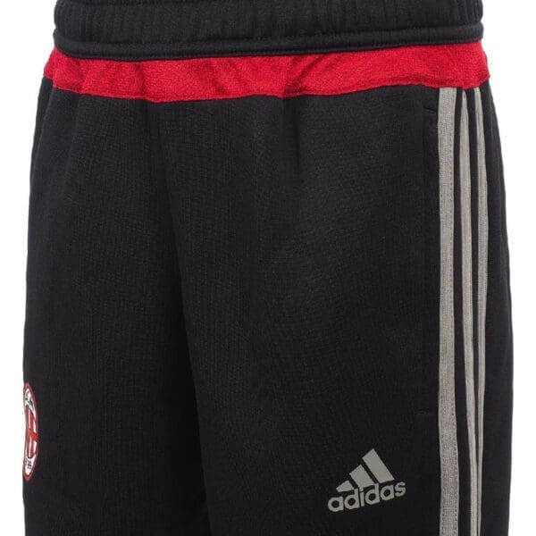 Black Adidas sweatpants with red stripe.