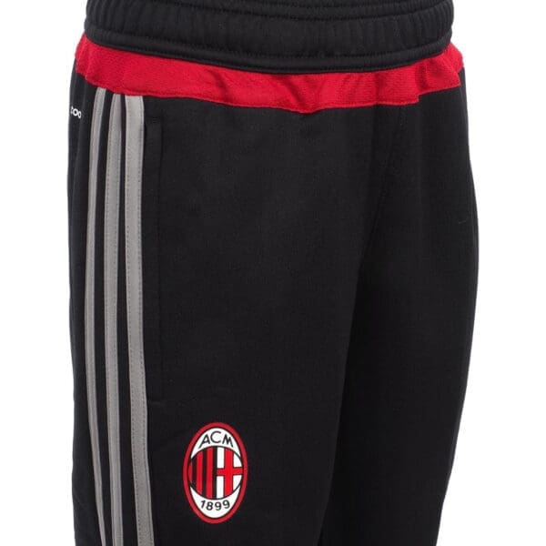 Black AC Milan sweatpants with stripes.