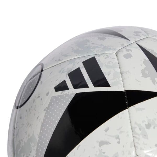 Close-up of a white soccer ball with black stripes.