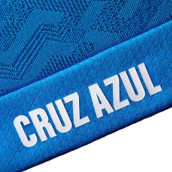 Blue jersey with Cruz Azul logo.