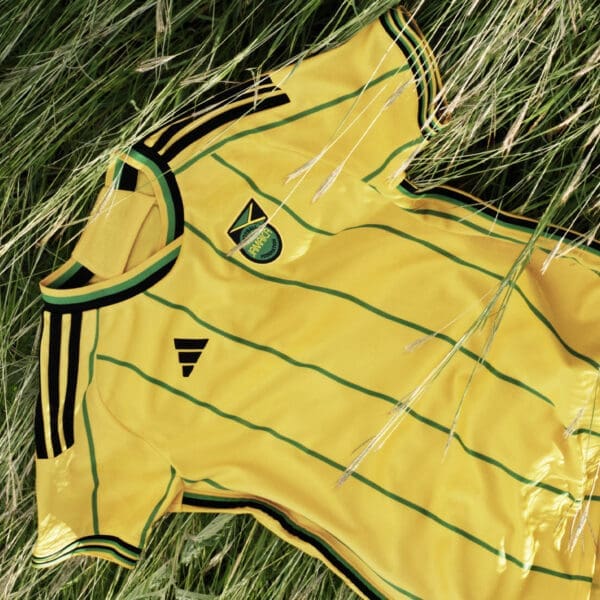 Yellow and green striped Jamaica soccer jersey.