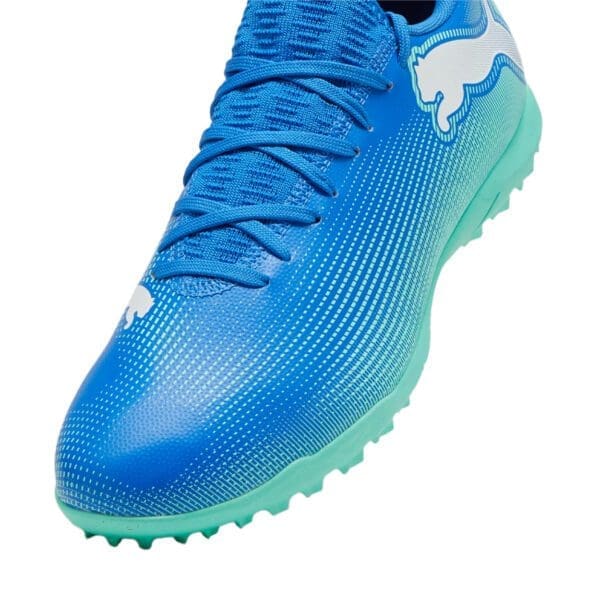 Blue and green Puma soccer cleats.