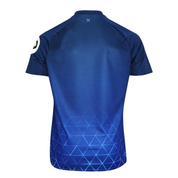 Blue soccer jersey with geometric pattern.