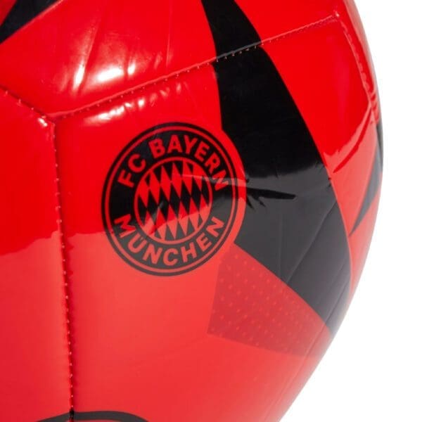 Red and black soccer ball with FC Bayern Munich logo.