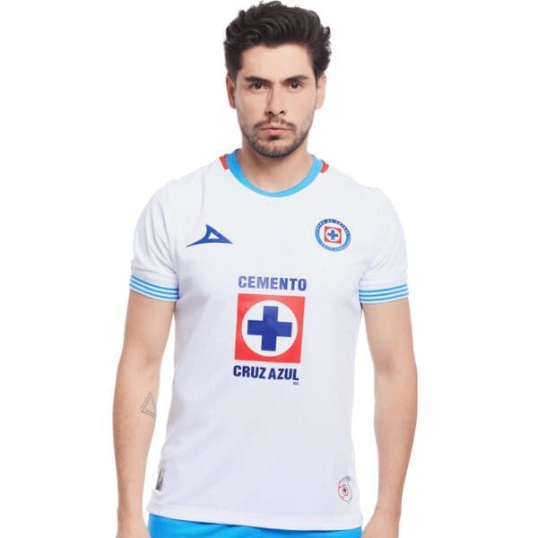 Man wearing a white Cruz Azul soccer jersey.