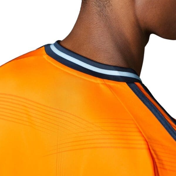 Orange soccer jersey with blue and black trim.