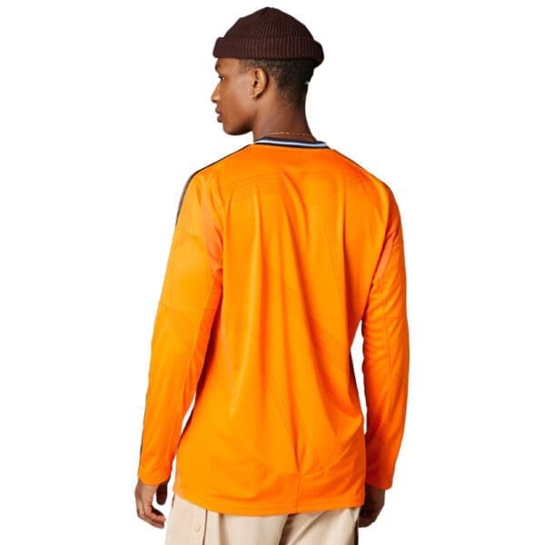 Man wearing an orange long-sleeve shirt