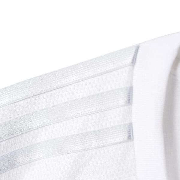 White shirt with three stripes.