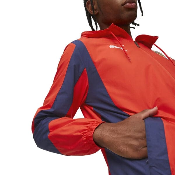 Red and blue Puma jacket with a hood.